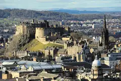 Edinburgh Castle on its rock, above the rooftops of the city centre, in Scotland